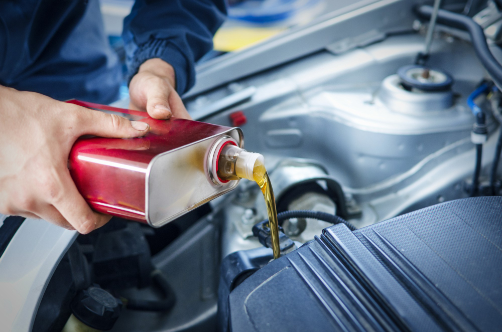 mechanic changing engine oil car vehicle